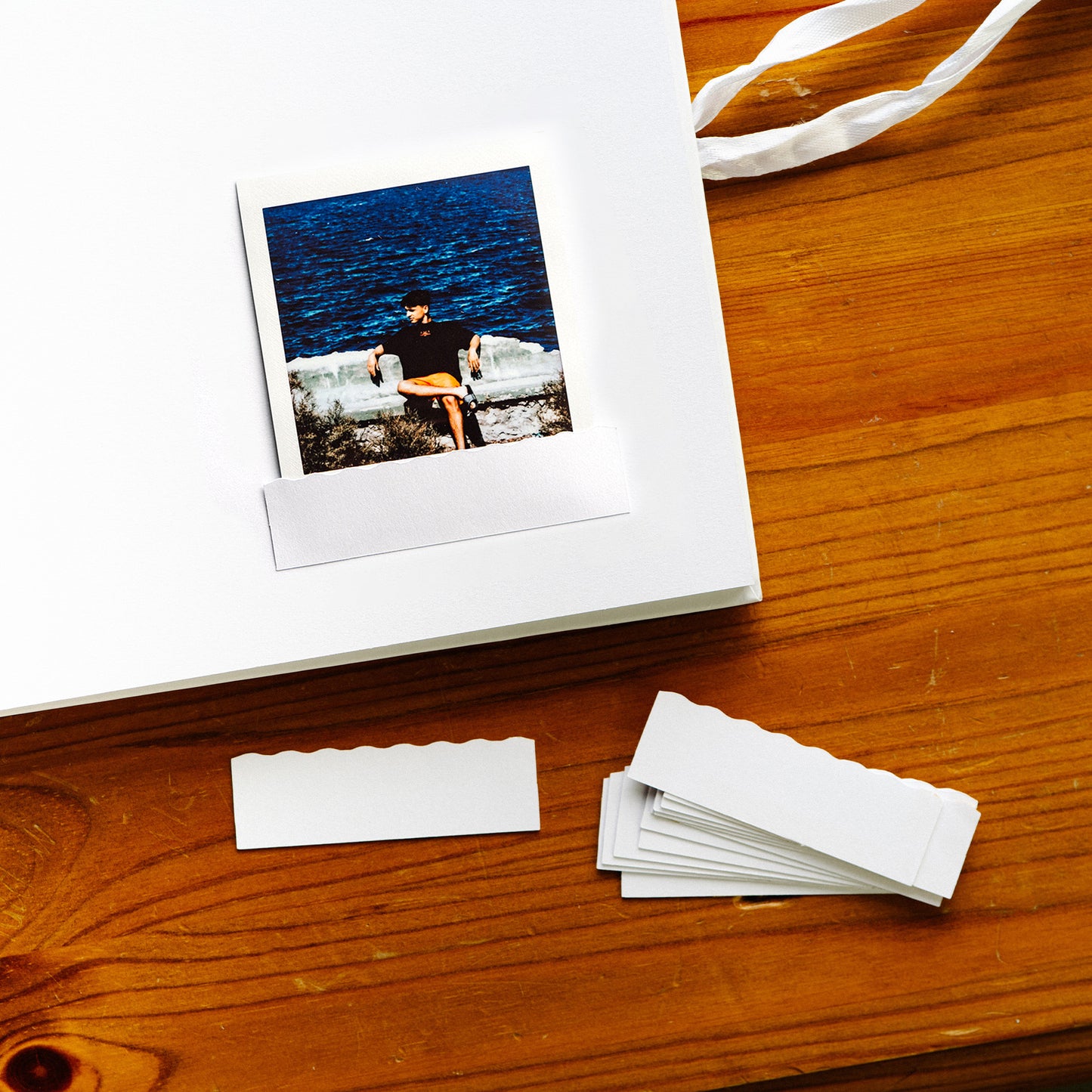 Premium photography pocket for Instax Square photos, designed for safe storage in albums. This high-quality, protective sleeve ensures your Instax Square prints remain pristine and securely displayed, perfect for albums, wedding guest books, and scrapbooks.